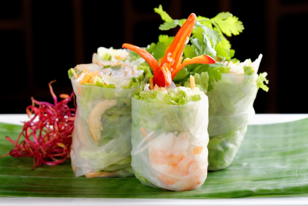 Vietnamese salad rolls with shrimps, chicken, herbs, green papaya and sour mango